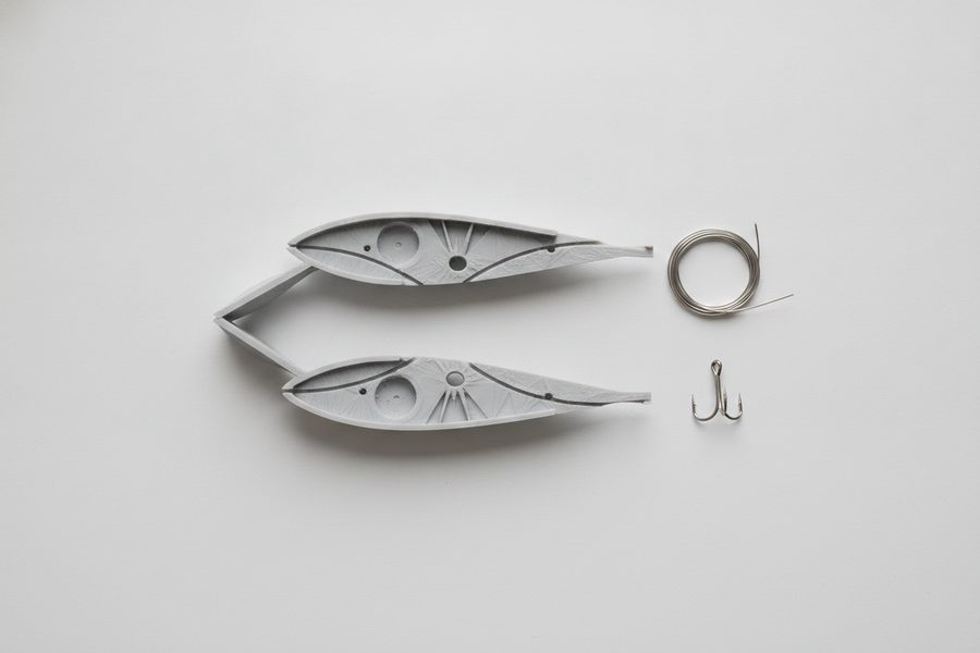 Open 3D printed lure halves with through-wire harness and hooks laid out